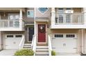 Townhome front door with inviting entrance, seasonal wreath, and covered porch at 1741 Liberty Nw Pkwy, Atlanta, GA 30318