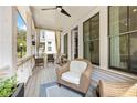 Cozy outdoor patio with wicker seating, ceiling fan, and natural light providing a relaxing atmosphere at 2200 Cortland Rd, Milton, GA 30009