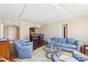 Open-concept living room boasts hardwood floors, neutral walls, and stylish furniture with a view to the kitchen at 3481 Lakeside Ne Dr # 2203, Atlanta, GA 30326