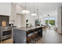 Modern kitchen featuring a marble island with seating, stainless steel appliances, and natural light at 1570 Flat Shoals Se Rd # 4, Atlanta, GA 30316