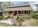 Charming exterior featuring a cozy front porch and manicured front yard at 3097 Sycamore Ln, Marietta, GA 30066