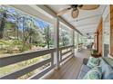 Spacious covered porch with comfortable seating and a scenic view at 3097 Sycamore Ln, Marietta, GA 30066