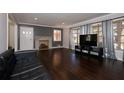 Bright living room features hardwood floors, a marble fireplace, and large windows at 819 Venetta Nw Pl, Atlanta, GA 30318