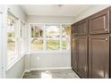Sunroom with large windows offering abundant natural light and backyard views at 5798 Salem Rd, Covington, GA 30016