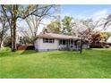 Well-maintained lawn surrounds a house with gray trim and a red roof at 5798 Salem Rd, Covington, GA 30016