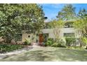 Charming home exterior featuring a well-manicured lawn and mature trees for enhanced curb appeal at 1211 Oakdale Ne Rd, Atlanta, GA 30307