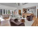 Sun-drenched living room featuring hardwood floors and an open concept layout to kitchen and dining area at 1211 Oakdale Ne Rd, Atlanta, GA 30307