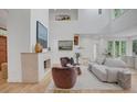 Bright living room with high ceilings, a fireplace, and ample natural light at 1211 Oakdale Ne Rd, Atlanta, GA 30307