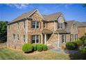Stunning two-story brick home showcasing detailed architecture, manicured lawn, and inviting curb appeal at 1250 Edgebrook Ln, Snellville, GA 30078