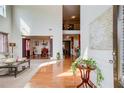 Bright living room showcasing hardwood floors, high ceilings, and seamless access to the dining area at 1250 Edgebrook Ln, Snellville, GA 30078