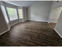 Bright living room featuring wood floors, vaulted ceilings, and large windows at 3763 Waldrop Hills Dr, Decatur, GA 30034