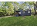 Inviting single-story house with a green lawn, complemented by the natural beauty of the surrounding trees and landscape at 3406 Randell Brown Avenue Unit 3, Atlanta, GA 30354