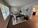 Open dining room with stylish decor, new flooring, and lots of light at 1968 Copperfield Cir, Decatur, GA 30035