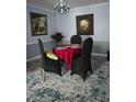 Cozy dining room with contemporary furnishings, paintings, and carpet at 136 Rue Fontaine, Lithonia, GA 30038