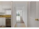 Bright hallway featuring hardwood floors and modern finishes throughout at 2870 Pharr Court South Nw # 1209, Atlanta, GA 30305