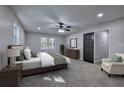 Bedroom featuring neutral decor, plush carpet, and a ceiling fan at 380 Inman Rd, Fayetteville, GA 30215