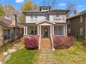 Beautiful two-story home featuring a welcoming front porch and well-maintained lawn at 1054 Euclid Ne Ave, Atlanta, GA 30307