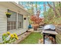 Back patio with grill and outdoor furniture creating an inviting outdoor space at 3075 Camden Way, Alpharetta, GA 30005