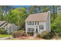 Charming home featuring a classic design, well-maintained landscaping, and a cozy, inviting facade with mature trees at 4783 Deer Chase, Powder Springs, GA 30127