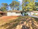 Charming single-story home featuring a freshly painted exterior and a well-maintained front yard at 1879 Shamrock Dr, Decatur, GA 30032