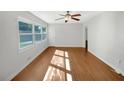 Bright living room boasts large windows, neutral walls, and beautiful flooring at 1879 Shamrock Dr, Decatur, GA 30032