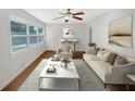Bright living room boasts large windows, neutral walls, and ample space for relaxation and entertainment at 1879 Shamrock Dr, Decatur, GA 30032