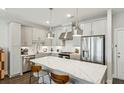 Modern kitchen featuring a large island, stainless steel appliances, and sleek cabinetry at 2420 Lakeshore Se Ln, Atlanta, GA 30316