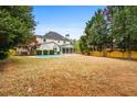 Spacious backyard with swimming pool, privacy fence, and mature trees at 5578 Hedge Brooke Dr, Acworth, GA 30101