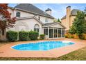 Inviting backyard pool with ample patio space for entertaining guests at 5578 Hedge Brooke Dr, Acworth, GA 30101