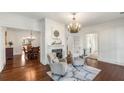 Bright living room with hardwood floors, fireplace and adjacent dining room at 73 Waddell Ne St, Atlanta, GA 30307