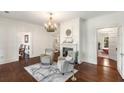Bright living room featuring hardwood floors, fireplace and adjacent rooms at 73 Waddell Ne St, Atlanta, GA 30307