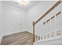 Bright foyer with vinyl wood flooring, white walls, and natural light near the front door at 1516 Parks Edge Nw Ln, Atlanta, GA 30318