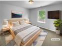 Serene main bedroom featuring a comfortable bed, soft lighting, and a window with a peaceful view at 280 Mcgiboney Ln, Covington, GA 30016