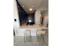 Modern kitchen with blue cabinets, a white marble countertop, stainless steel appliances, and bar stool seating at 285 Centennial Olympic Park Dr # Ph 1-4, Atlanta, GA 30313