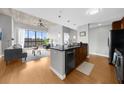 Sleek kitchen featuring a large island, stainless steel appliances, and hardwood floors at 563 Memorial Se Dr # 504, Atlanta, GA 30312
