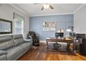 Stylish office with a blue accent wall, hardwood flooring, and ample workspace at 5950 Thoroughbred Way, Suwanee, GA 30024