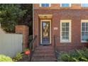 Inviting entryway with brick steps, decorative wreath, and clear house number at 900 River Vista Dr, Atlanta, GA 30339