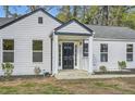 Charming home featuring a symmetrical design with a covered entry and manicured landscaping at , Atlanta, GA 30311
