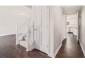 Bright entryway featuring wood floors, white trim, and staircase leading to the upper level at 1577 Linksview Close, Stone Mountain, GA 30088