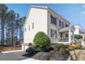 View of the home showing the classic design elements and an attached garage at 6463 Century Park Se Pl, Mableton, GA 30126
