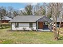 Charming renovated bungalow features a freshly painted exterior, new roof, and updated landscaping at 1751 Carter Cir, Atlanta, GA 30344