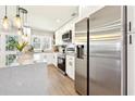 Stylish kitchen boasts stainless steel appliances, quartz countertops, and ample cabinet space at 1751 Carter Cir, Atlanta, GA 30344