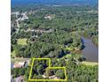 Spacious lot with mature trees near a large lake, as seen from above at 2962 Norman Cir, Duluth, GA 30096