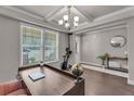 Bright office space with hardwood floors, coffered ceilings and large windows overlooking the front yard at 1105 Alaska St, Hampton, GA 30228
