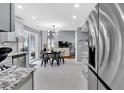 Open kitchen with stainless steel appliances and seamless flow to a breakfast area and living space at 2155 Westwind Dr, Roswell, GA 30075