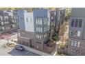 Aerial view of modern townhomes, showcasing architecture, landscaping, and parking at 379 Pratt Se Dr # 408, Atlanta, GA 30315