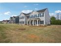Beautiful two-story home showcasing a well-manicured lawn in a suburban neighborhood at 156 Marchmont Dr, Locust Grove, GA 30248