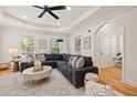 Bright living room with hardwood floors, tray ceiling, and large windows at 770 Reed Se St, Atlanta, GA 30315