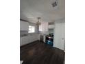 Bright kitchen featuring new appliances, white cabinetry, and granite countertops at 8154 Tudor Dr, Jonesboro, GA 30238