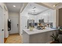 Bright kitchen with white cabinetry, stainless steel appliances, and sleek quartz countertops at 1850 Cotillion Dr # 2221, Atlanta, GA 30338